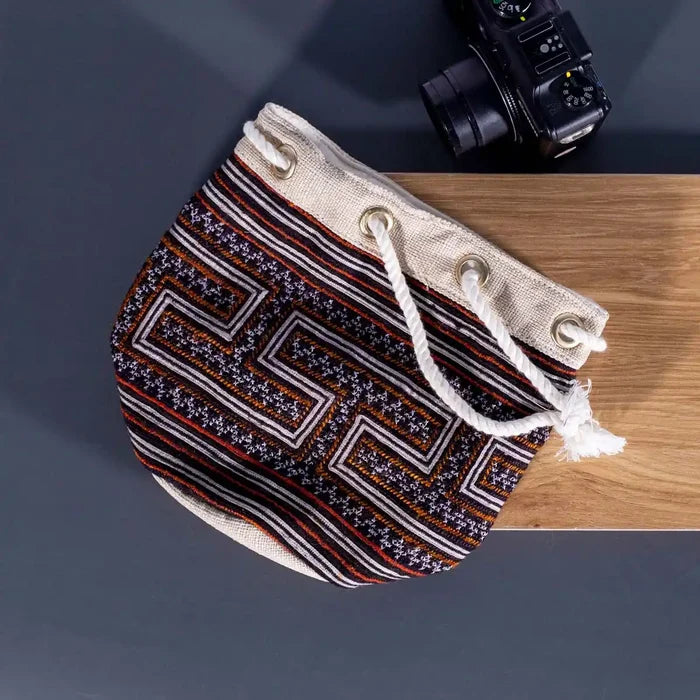 Vindigo brown embroidered canvas bucket bag flat angle view