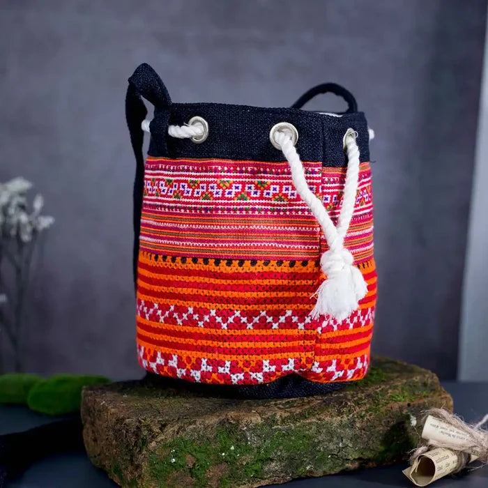 Vindigo orange hemp tribal embroidered bucket bag side angle view