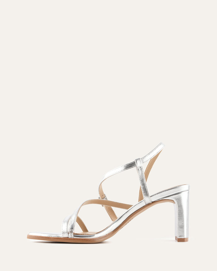Silver high-heeled sandal on a white background