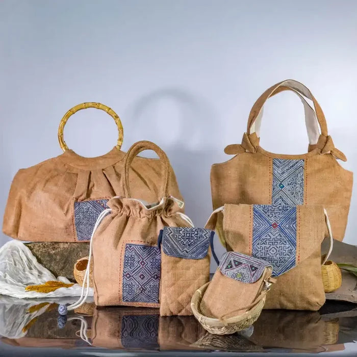 Natural hemp bucket bag with H’Mong patch, eco-friendly design displayed with other hemp handbags.