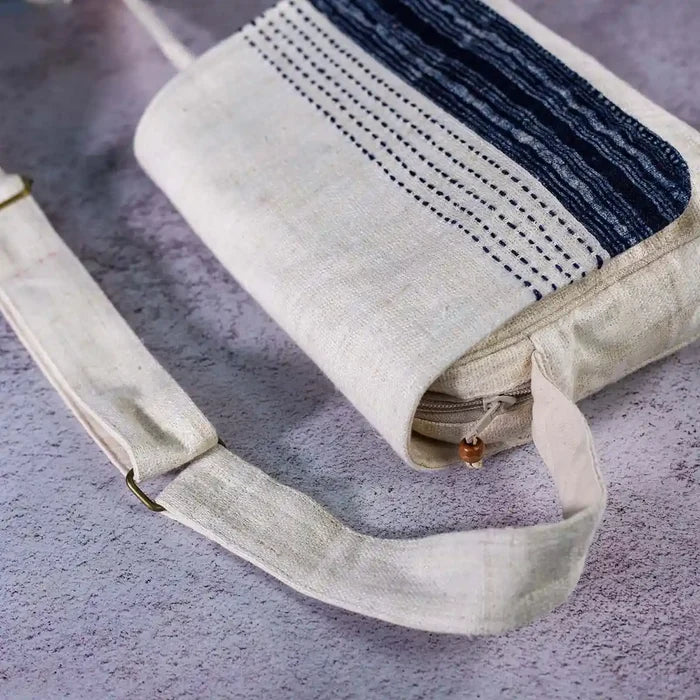 Vindigo crossbody bag close-up of hand-stitched indigo batik flap