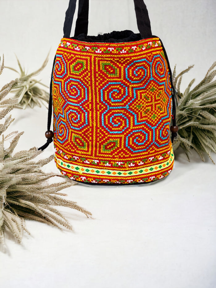 Neon blue and red embroidery shoulder bag with string to close