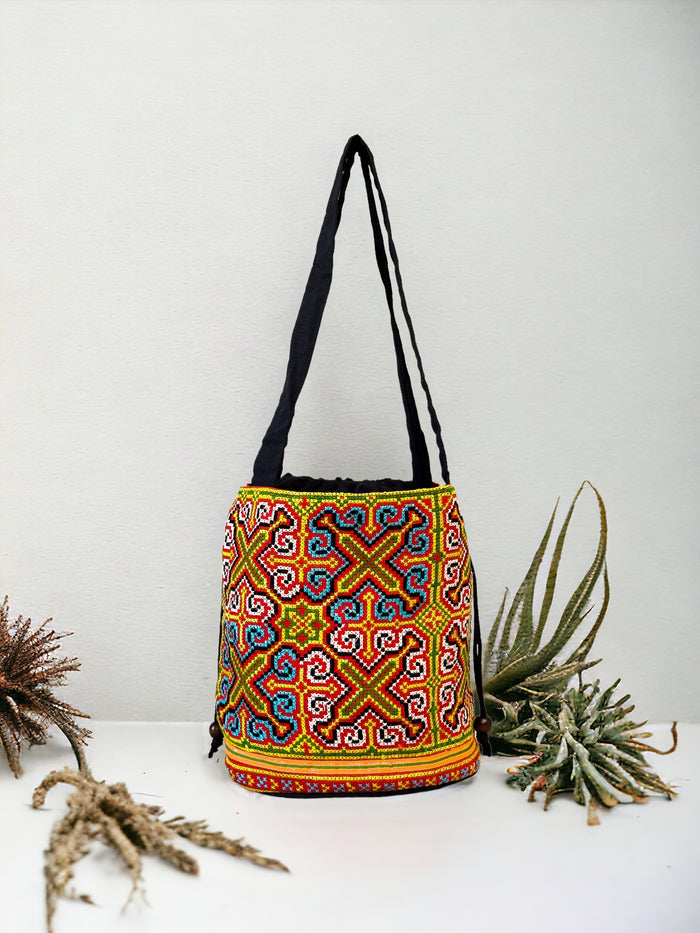 Neon blue and yellow embroidery shoulder bag with string to close