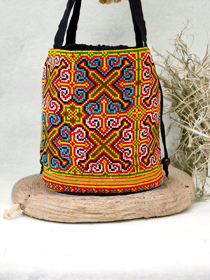 Neon blue and yellow embroidery shoulder bag with string to close