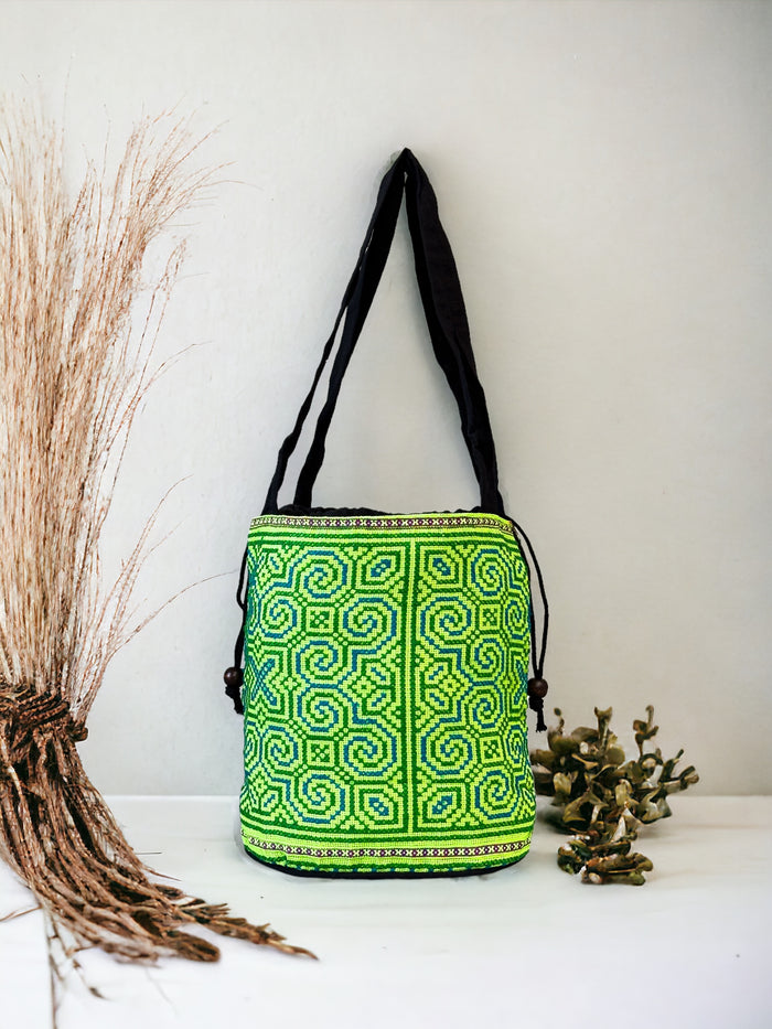 Neon green embroidery shoulder bag with string to close