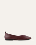 Maroon flat shoe on a white background
