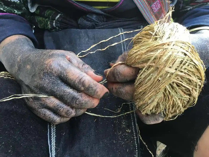Vindigo artisan preparing hemp yarn for weaving manually