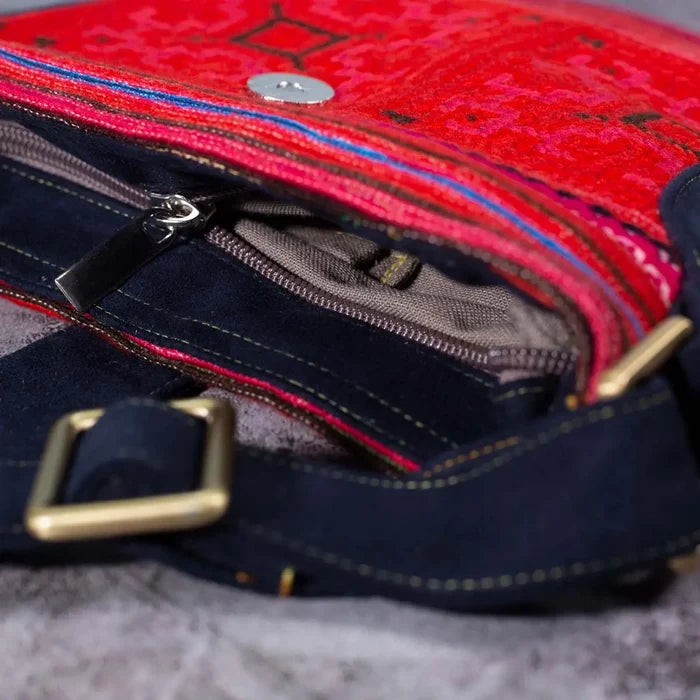 Vindigo red hemp crossbody bag zipper and strap detail with dark leather buckle