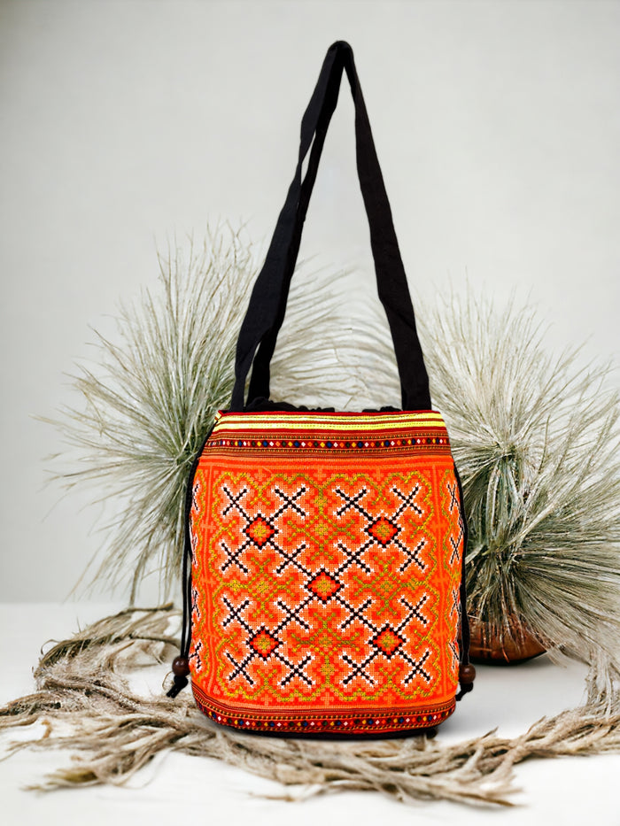 Orange embroidery shoulder bag with string to close