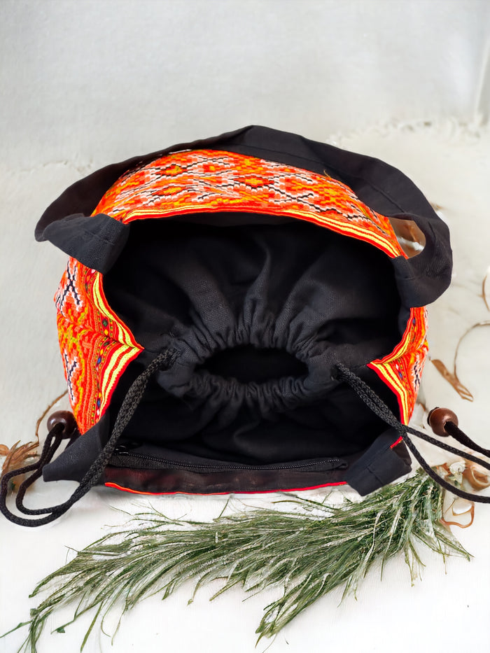 Orange embroidery shoulder bag with string to close