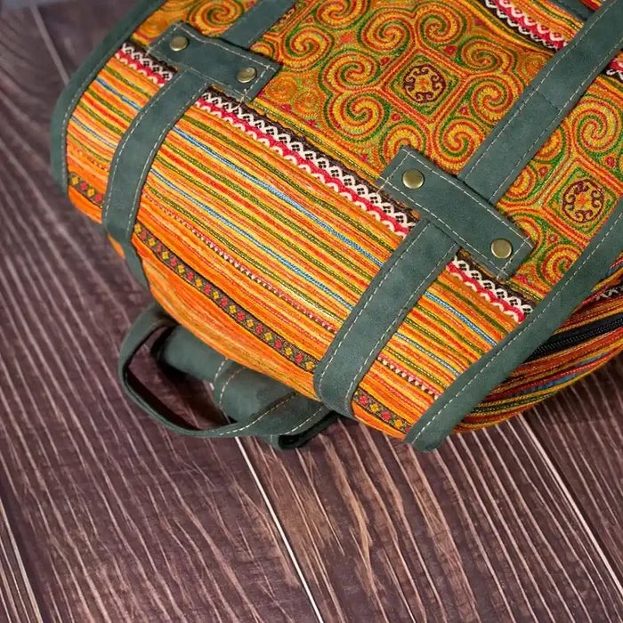 Vindigo yellow embroidered cotton backpack angled pattern view