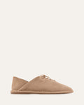 Beige flat shoe on a white background