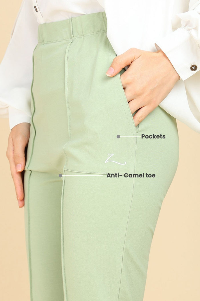 Pistachio Cotton Pants pocket; functional pockets store phone and essentials.