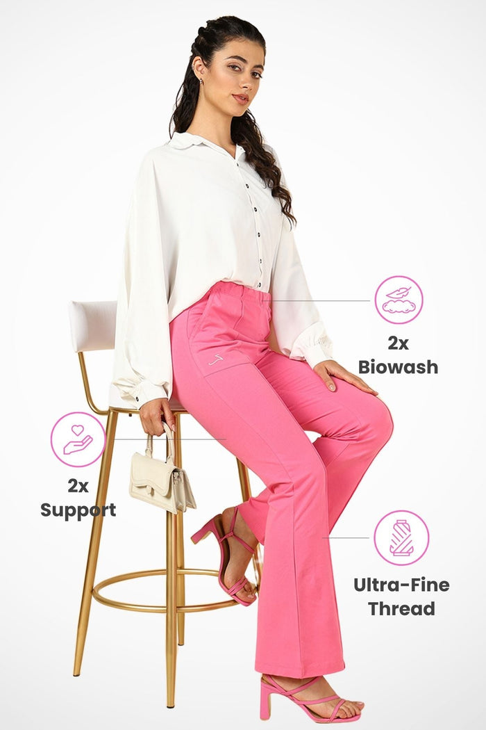 Model wearing Pink Maternity Pants; over-the-belly panel offers coverage and support.