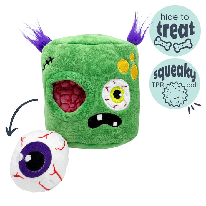 Dog with Pop 'n Fetch Zombie Pop-Eye Dog Toy on a white background.