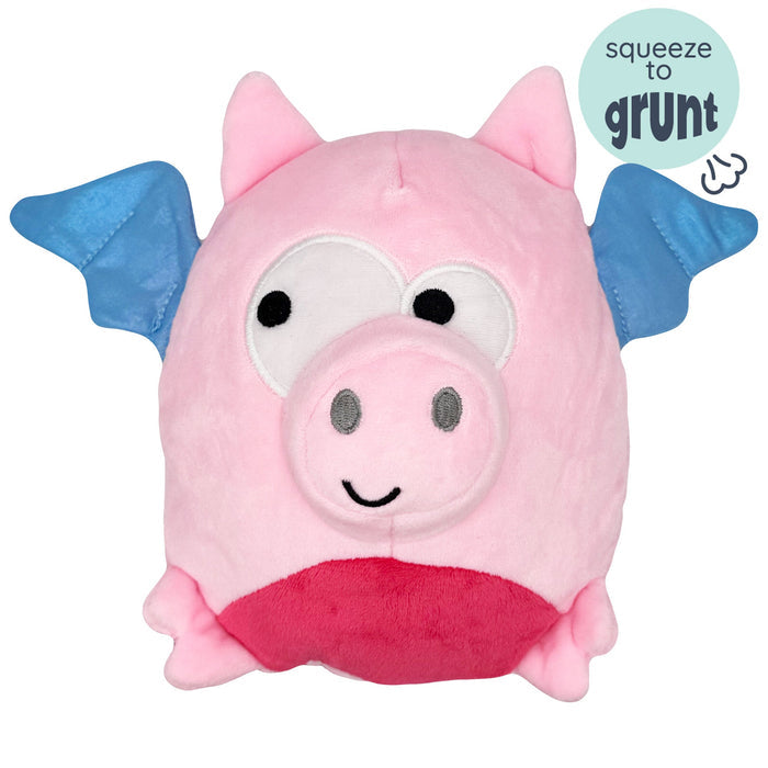 Dog with Pudgies Flying Piggasus Dog Toy on a white background.