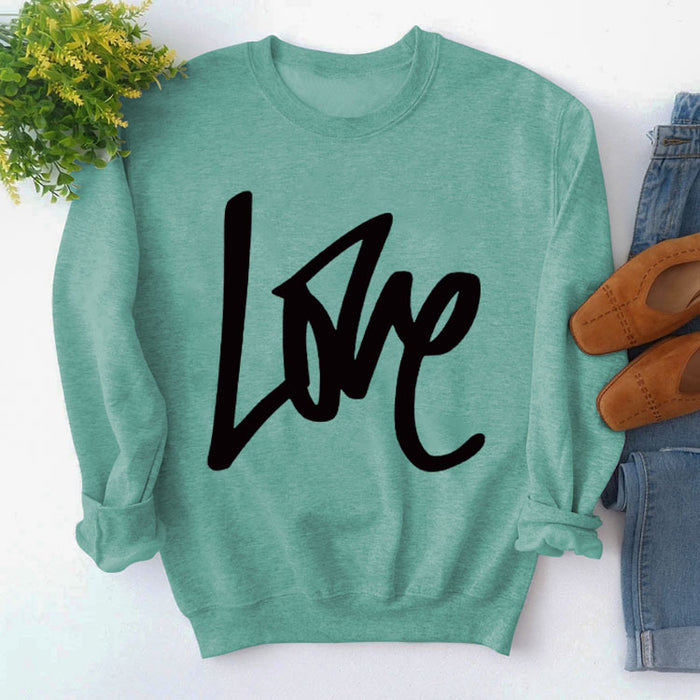 Light green sweater (black font) / S