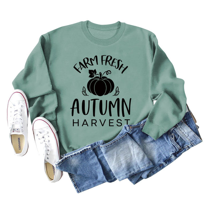 Light green sweater (black font) / S