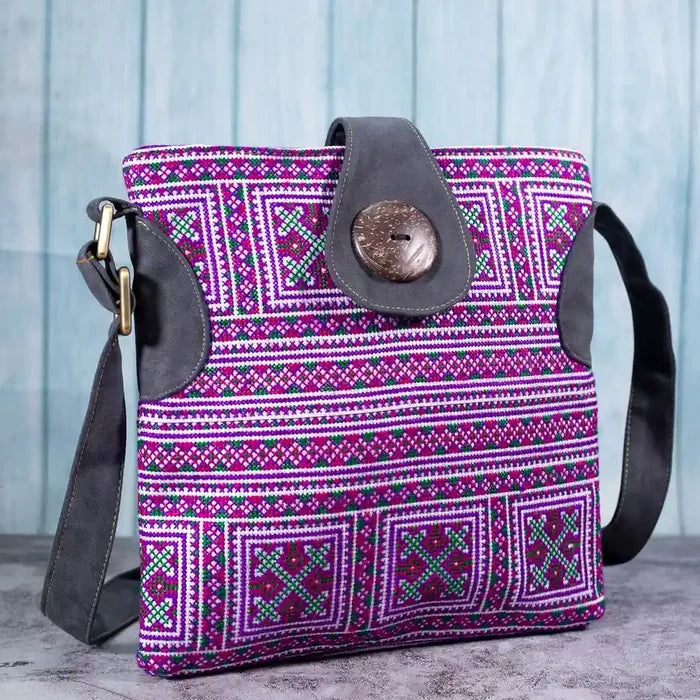 Vindigo purple embroidered crossbody bag side view with grey faux leather strap