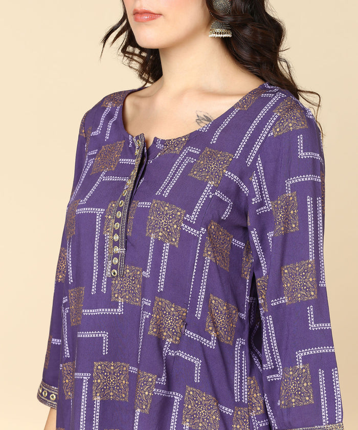 Purple Top with Pocket; pockets provide utility for carrying essentials.