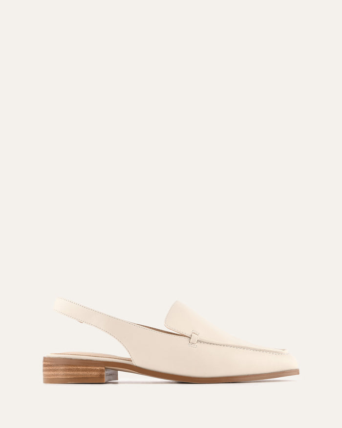 White loafer-style shoe on a light gray background
