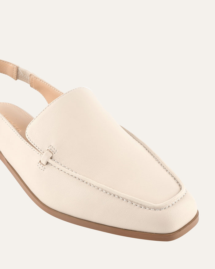 Beige loafer shoe on a white background