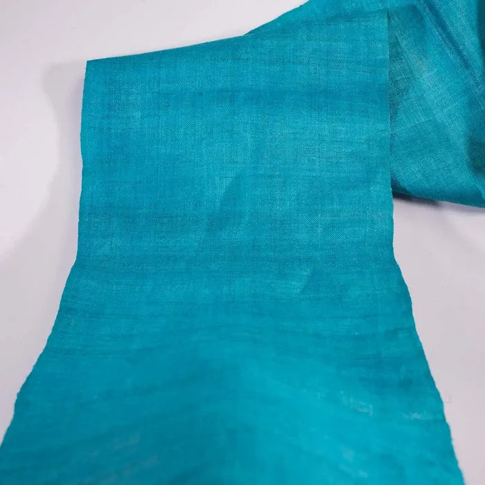 Vindigo turquoise plain hemp fabric roll opened partially