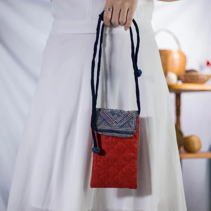 Red hemp mobilväska, small phone bag with authentic H’mong patch, artisan-made eco-friendly design.
