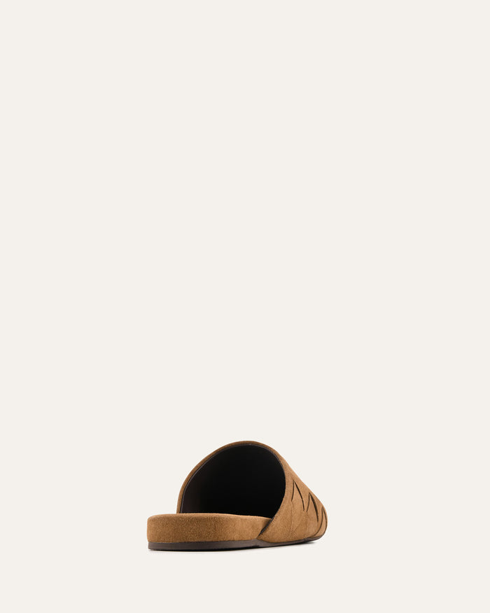 Brown pet bed on a beige background