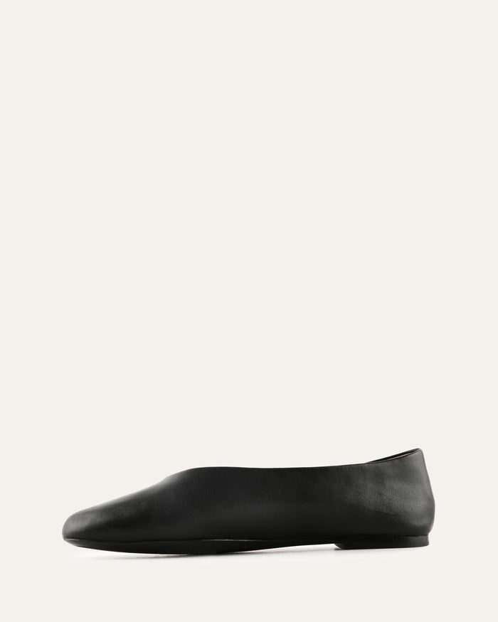 Black flat shoe on a white background