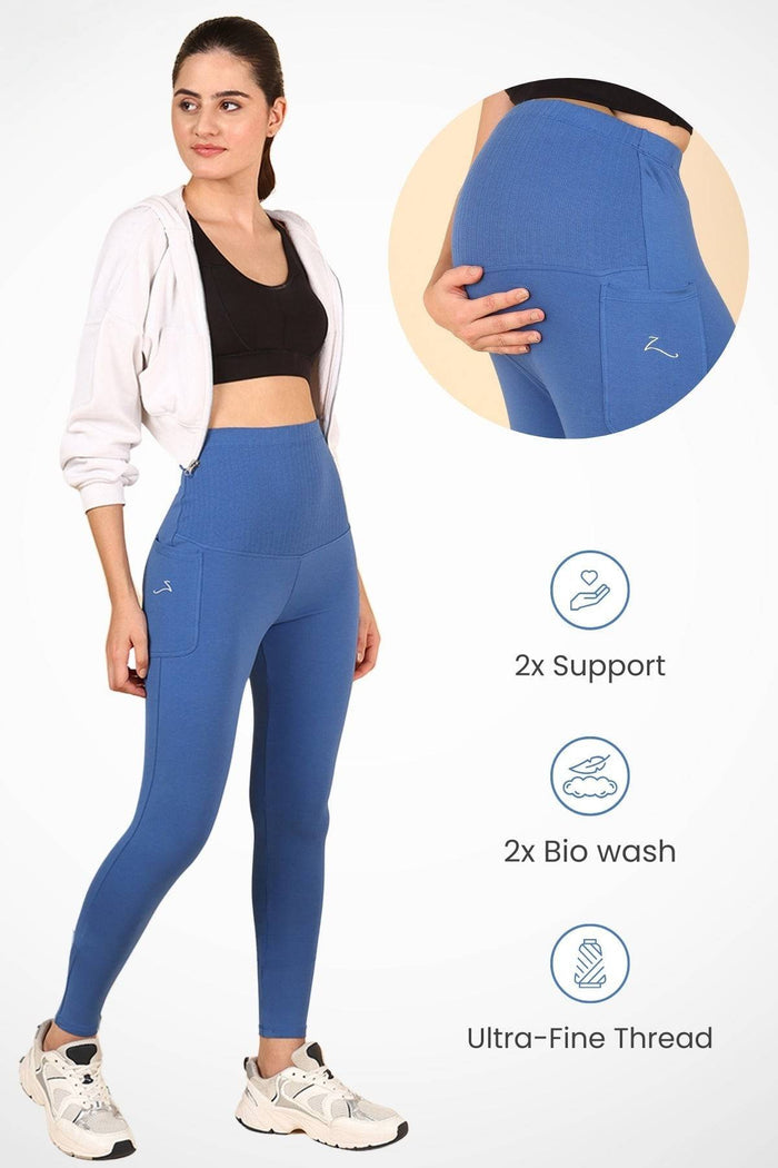 Model wearing Blue Ribbed Legging; wide ribbed cotton panel stretches comfortably over the pregnant bump.