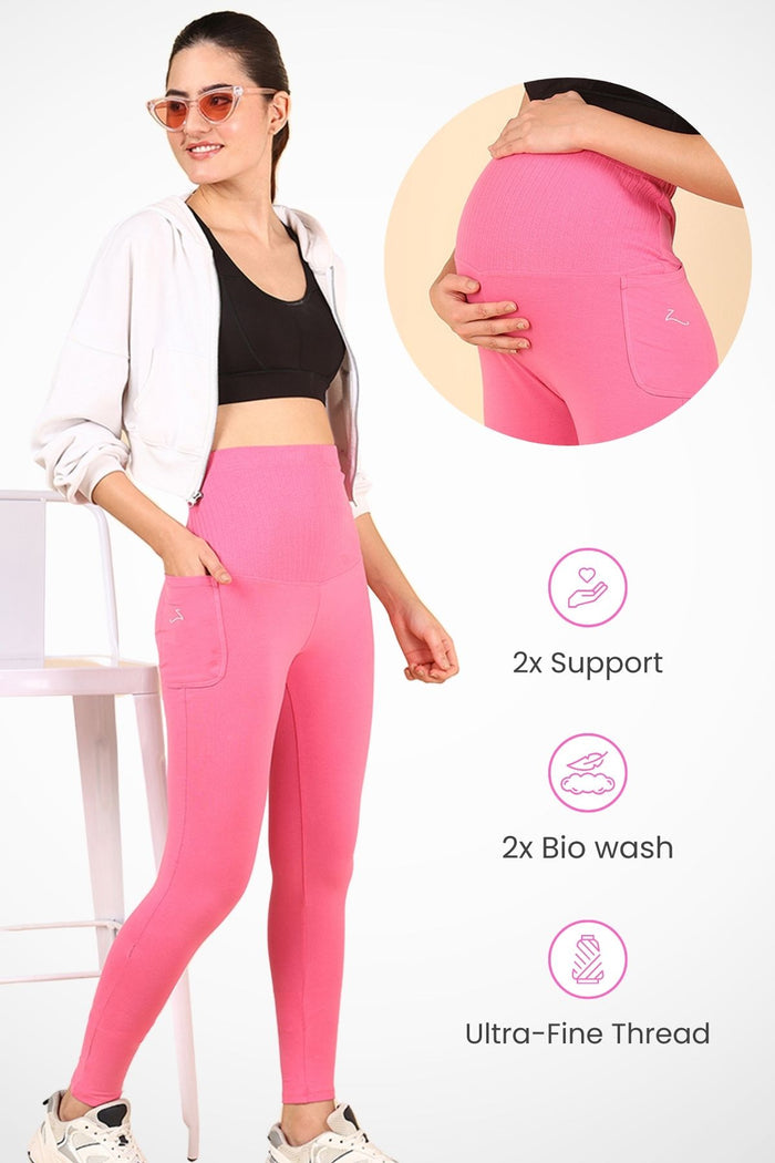 Model wearing Pink Ribbed Legging; wide ribbed panel stretches comfortably over the pregnant bump.