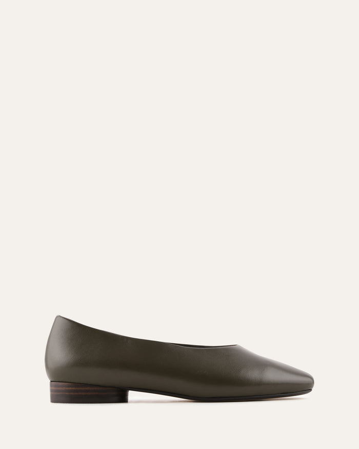 Green flat shoe on a white background