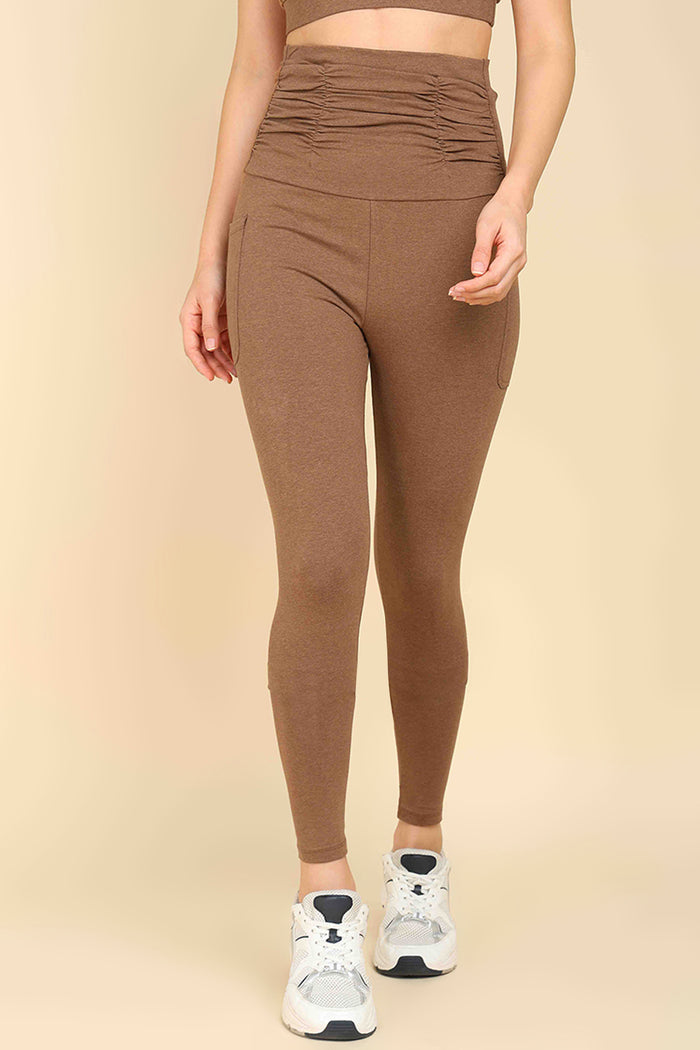 Brown Ruched Legging for prenatal movement; soft fabric supports low-impact maternity exercise.