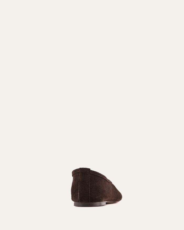 Brown suede shoe on a white background