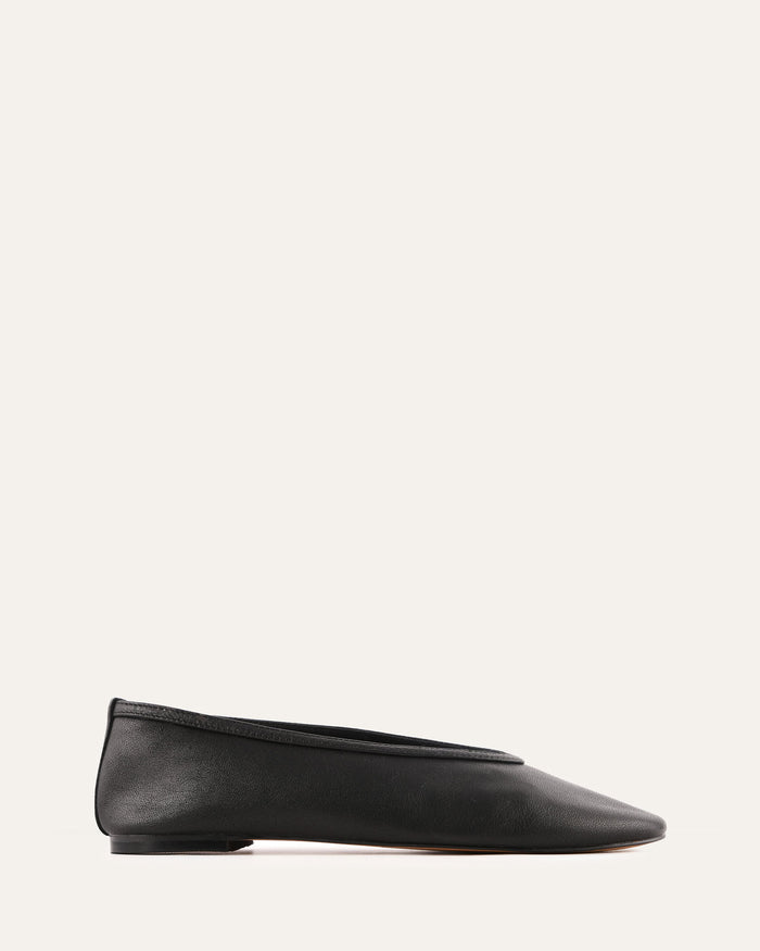 Black flat shoe on a white background