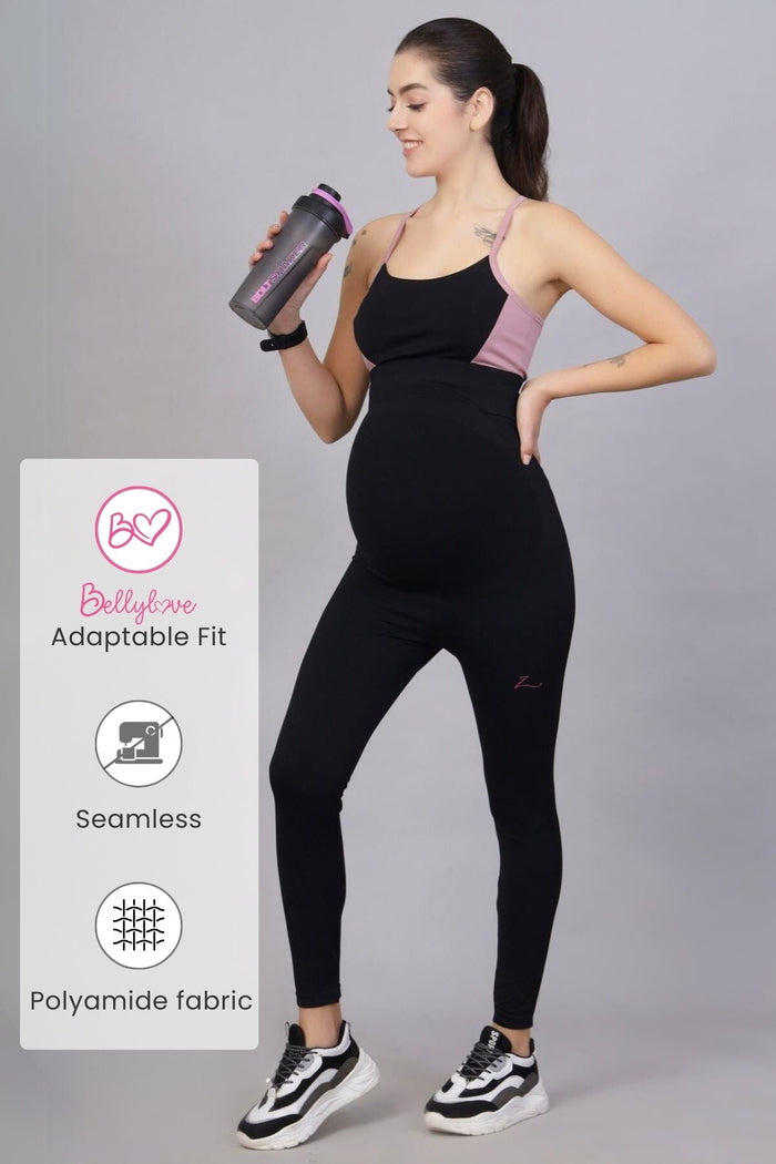 Model wearing Black Maternity Leggings; high waist provides full coverage and support.