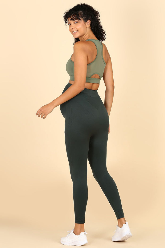 Green Leggings; leggings support abdomen during postpartum recovery.