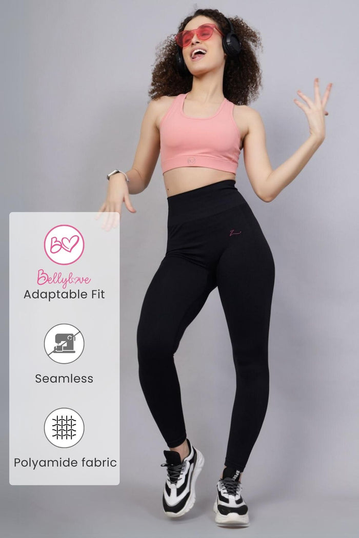 Model wearing Black Seamless Leggings; fabric offers smooth compression fit.