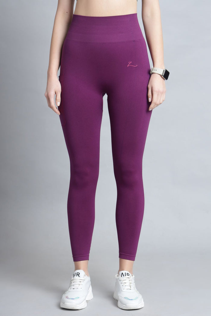 Model wearing Wine Seamless Leggings; garment provides a smooth silhouette.
