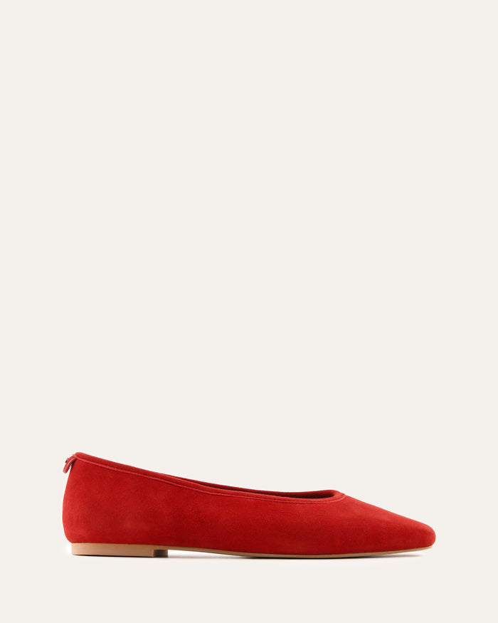 Red flat shoe on a white background