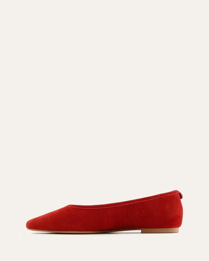 Red flat shoe on a white background