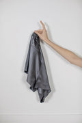 Signature Edit Anthracite Lounge Shorts held loosely by the waistband.