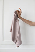 Signature Edit Pink Lounge Shorts held loosely by the waistband.