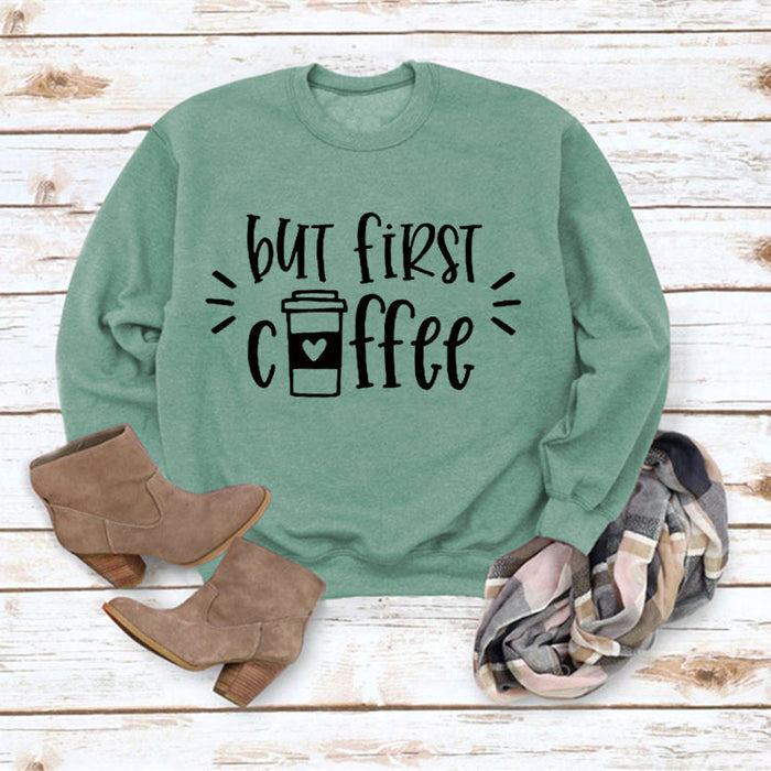 Light green sweater (black font) / S