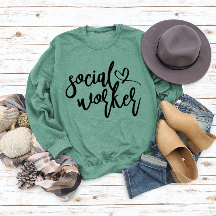 Light green sweater (black font) / S