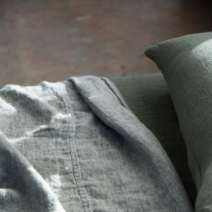 Close-up of a textured bedspread with a pillow