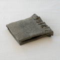 Folded gray fabric on a white background