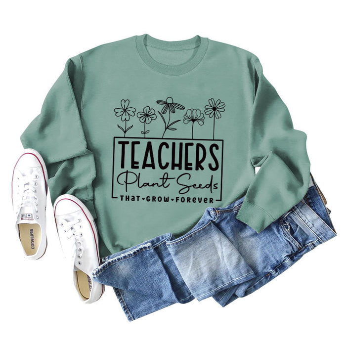 Light green sweater (black font) / S