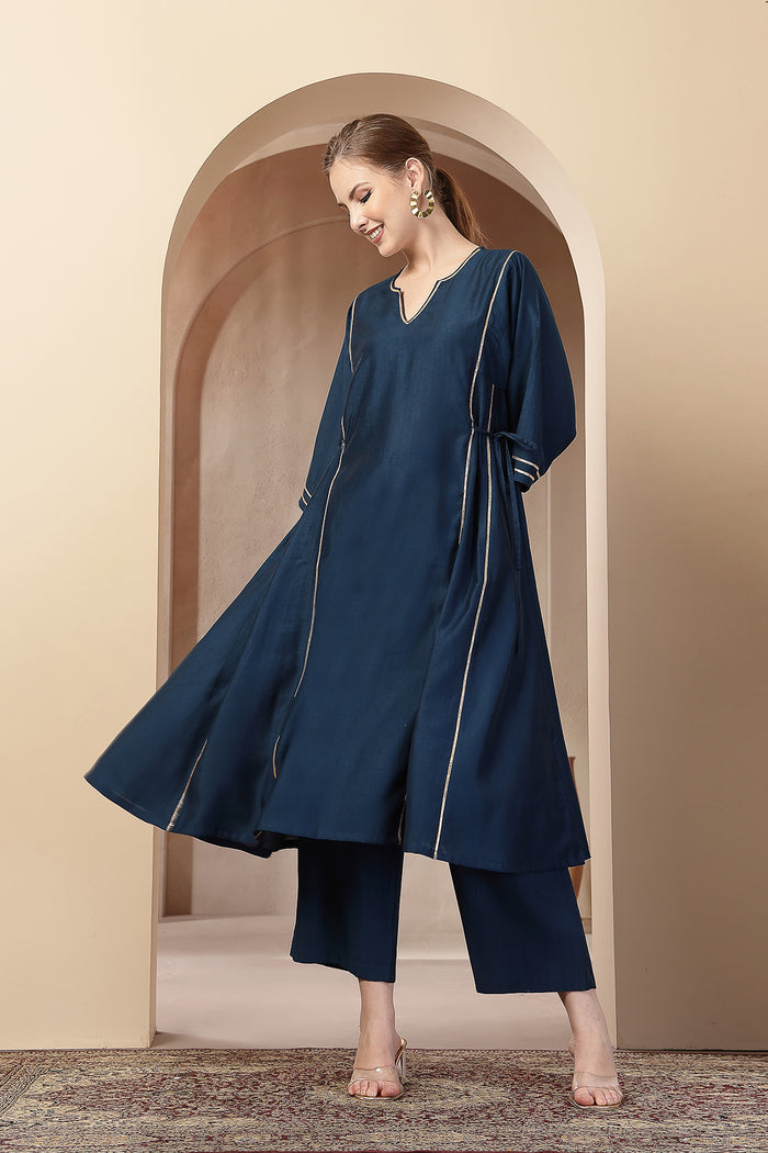 High-quality image of the Roman Silk texture and finish of the Teal Concealed Zip Suit Set.
